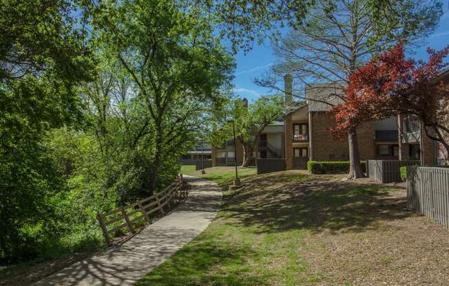 Chisholm Trail walking path beside our apartments at Chisholm Place Apartments in Plano, TX