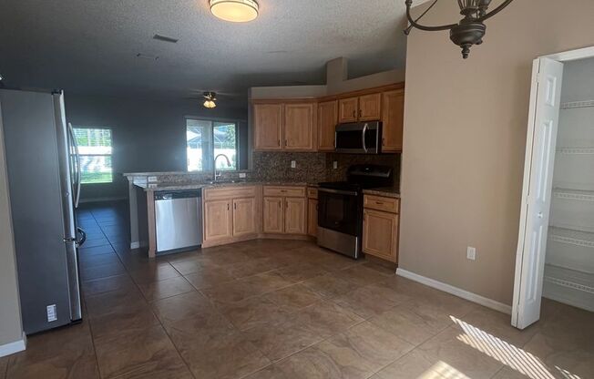Updated Single family 3 / 2 with Screened in Patio!