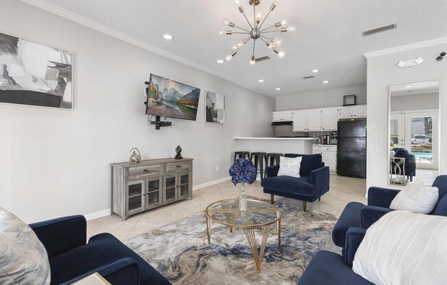 a living room filled with furniture and a tv