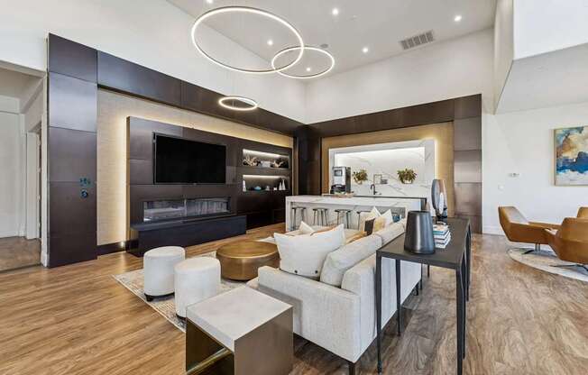 A modern living room with a white sofa and a television.