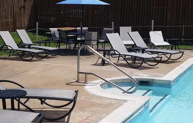 Outdoor Pool with Lounges and Tables