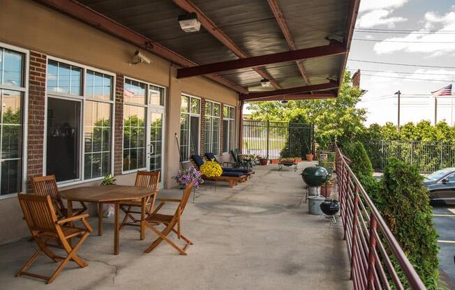 a patio with tables and chairs at The Lofts at Elk Terminal, Buffalo, 14204
