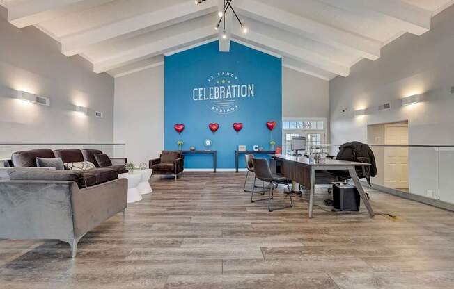 A room with a blue wall and a sign that says "CELEBRATION" is shown.