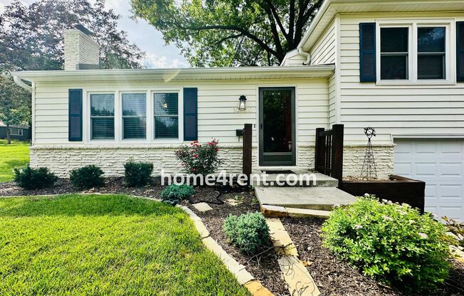 Beautiful Overland Park Home w/ Wood Floors, SS Appliances, Finished Basement and a Fenced Yard! (LAWN CARE INCLUDED!!)