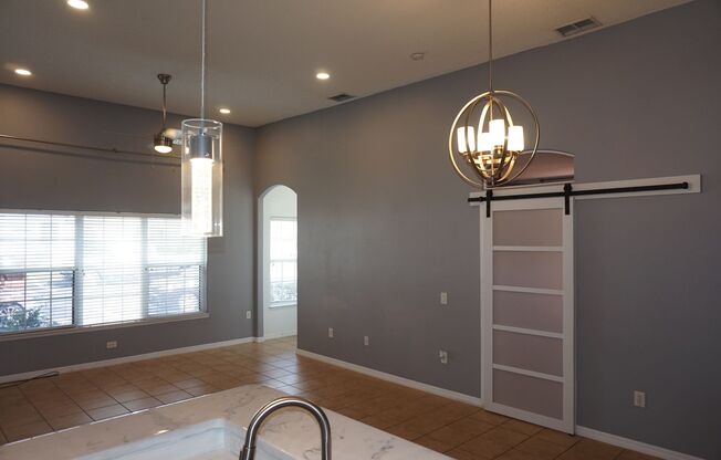 Designer 3/2 with 2 Car Garage in Desirable Location