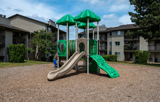 a playground at the whispering winds apartments in pearland, tx