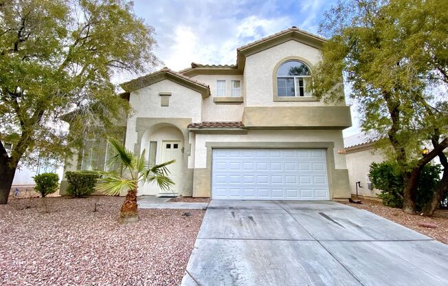 Perfect family home in Rhodes Ranch guard gated golf course community with a full bedroom and bathroom on the first floor!