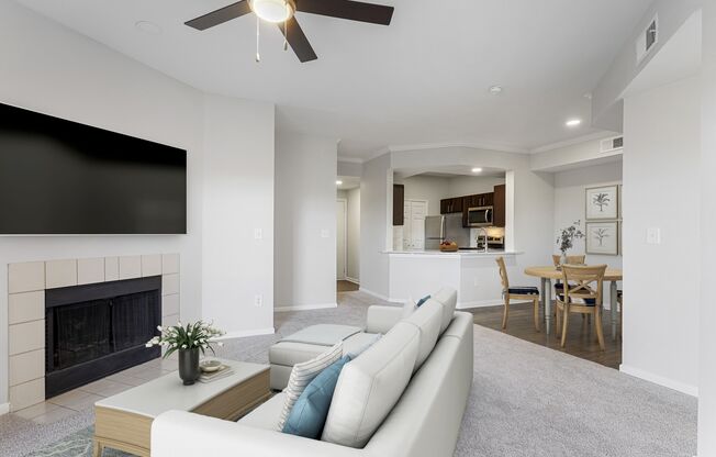 a living room with a couch and a fireplace at The Legends at Eagle Mountain Lake, Fort Worth, Texas