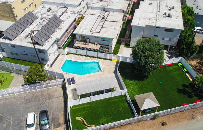 Aerial drone image of pool, pet play park, and community park at Cedar Glen.