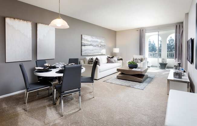 A modern living room with a dining table and chairs. at La Jolla Crossroads Apartments, California, 92122