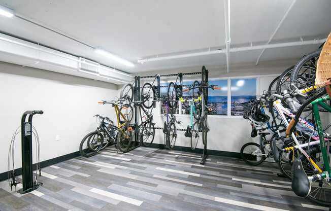 A bike rack with bicycles in a room.