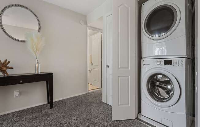 a small laundry room with a washer and dryer Kenilworth at Charles, Towson MD