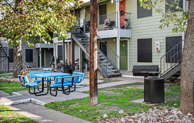 our apartments have a patio with tables and chairs