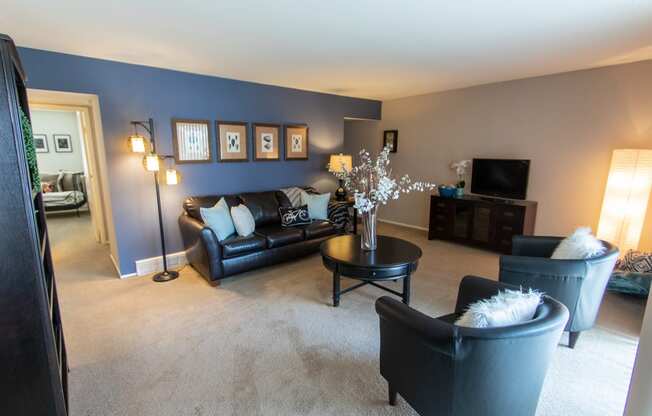 This is a picture of the living room in the 980 square foot, 2 bedroom, 1 bath model apartment at Fairfield Pointe Apartments in Fairfield, Ohio.