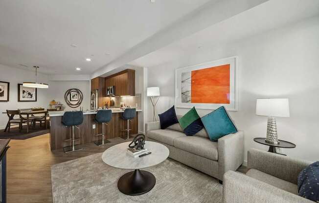 Living room with kitchen view at Bayview Apartments, Emeryville, CA
