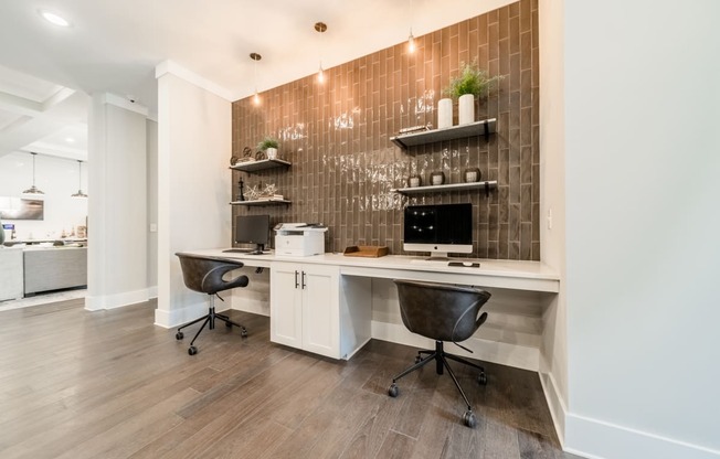 a home office with a white desk and a desktop computer