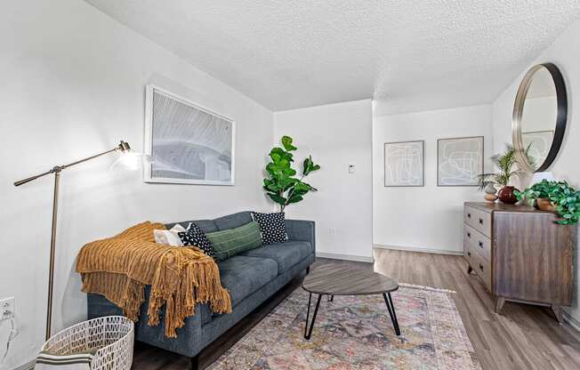 a living room with a couch and a dresser