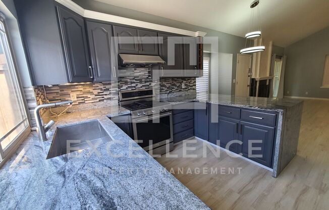 2/1 Single Story Condo With 2 Car Garage, Private Front & Back Patio & Updates Throughout!