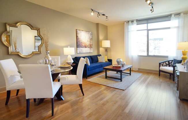 a living room and dining room with a couch and a table