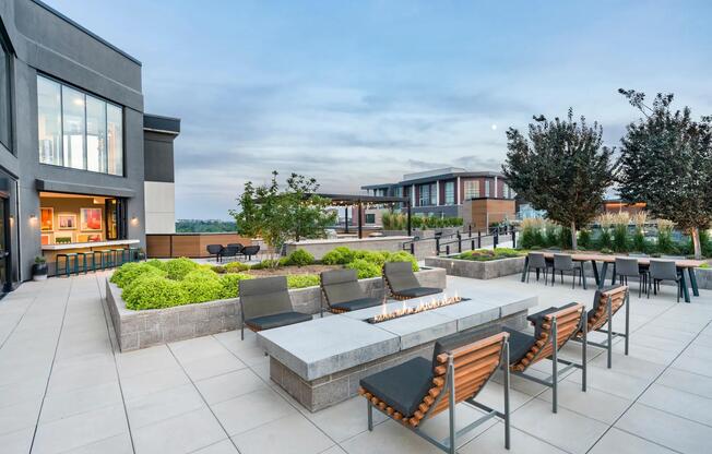 Enjoy the rooftop terrace with fire pits, dining areas, and skyline views.