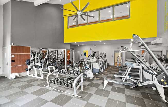 A gym with a variety of equipment including weights and cardio machines. at Northpoint Apartments, Washington
