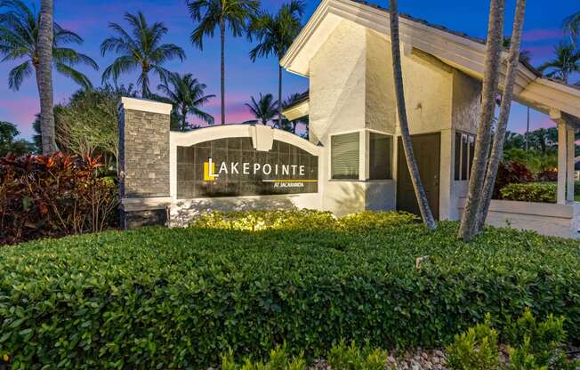 a building with a sign that says lake pointe apartments