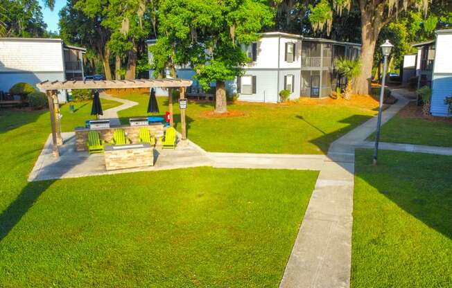 a backyard with a picnic table and a swing