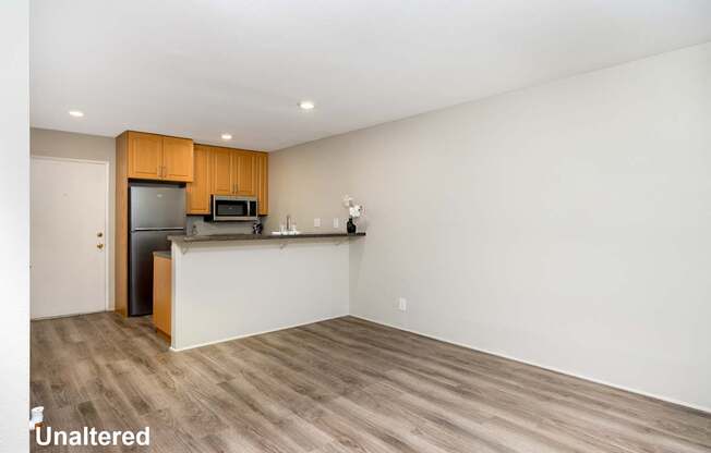 A kitchen with wooden cabinets and a white countertop.