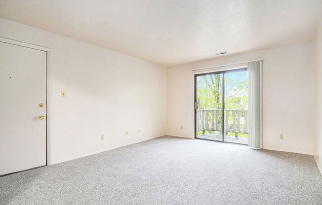 open living room with a balcony at Briarwood Apartments, Benton Harbor, 49022