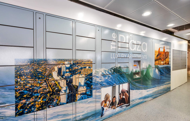 a wall with a large mural of a city on it  at The Plaza Apartments, Los Angeles, CA