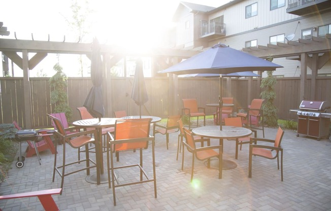 Outdoor Community Patio with Tables and Grill