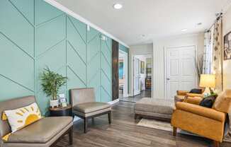 a living room with a blue wall and furniture