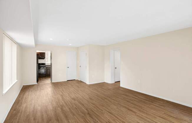 A room with wooden floors and white walls.