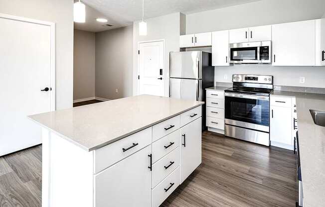 Studio, one two and three bedroom apartments and townhomes featuring open concept floor plans, dens, large windows, stainless steel appliances, quartz countertops, eat-in kitchens, pantries, LVT flooring and much more at The Trails at North Streams in Omaha, NE