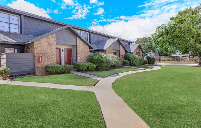 a large lawn in front of a house