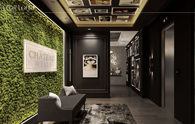 a living wall with green plants and a chair in a lobby at Chateau on Wells, Chicago, 60654
