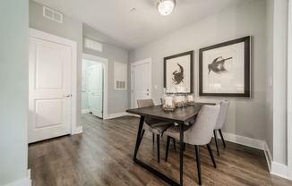 an open living room and dining room with a table and chairs