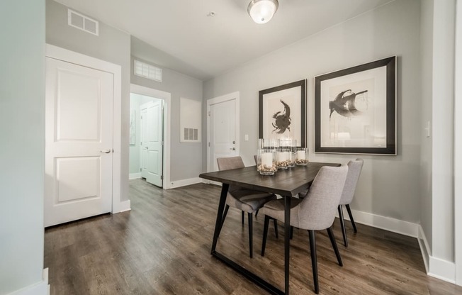 an open living room and dining room with a table and chairs