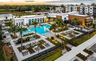 an aerial view of a resort with a pool and buildings at The Alibi at Lake Lilly, Ocoee, FL