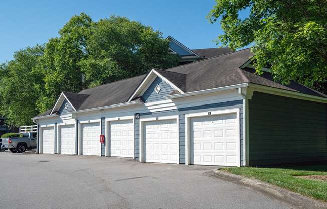 a row of garages in front of a house