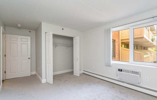Kimball court renovated apartment bedroom with window and extra sunlight