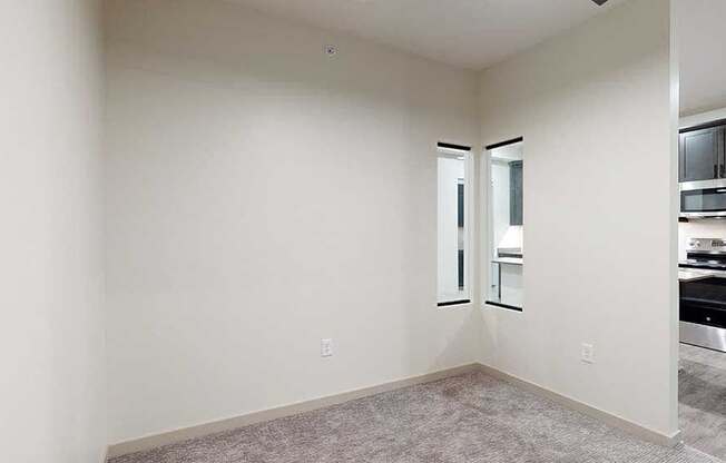 a sleeping area with a privacy wall with a small window