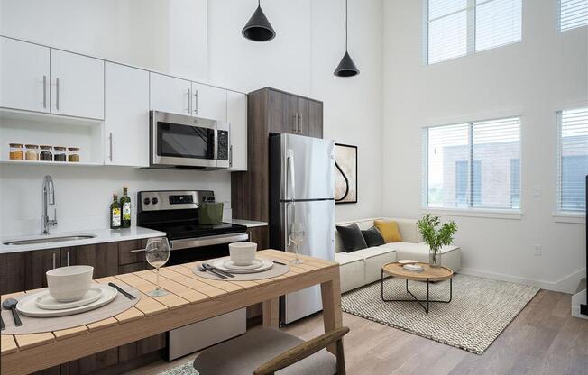 a kitchen and living room in an apartment