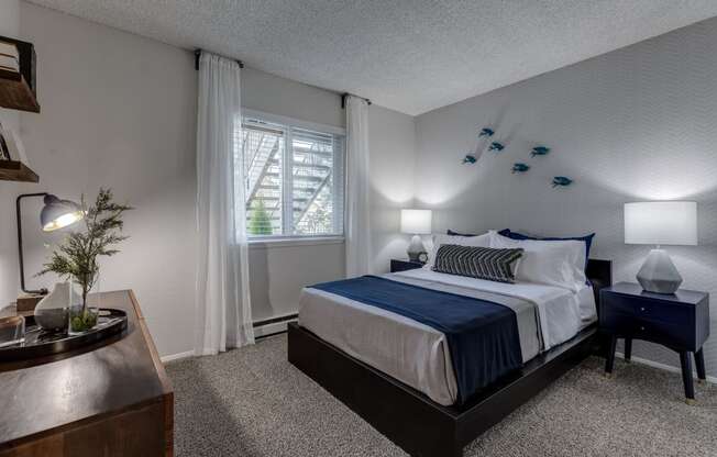 a bedroom with a bed and a window