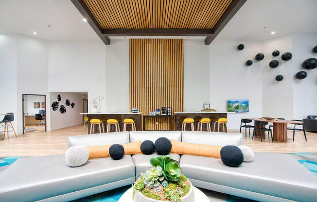 the lobby or reception area of a hotel with couches and tables at Presidio Palms Apartments, Arizona, 85701