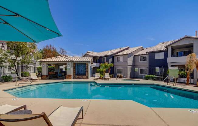 our apartments offer a swimming pool with chairs and umbrellas