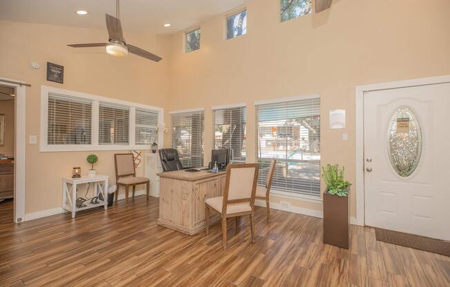 a living room filled with furniture and a large window