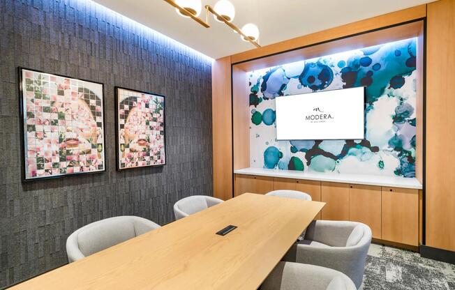 Host a meeting or brainstorm in the conference-style private coworking space, complete with sleek seating, modern tech, and vibrant design.
