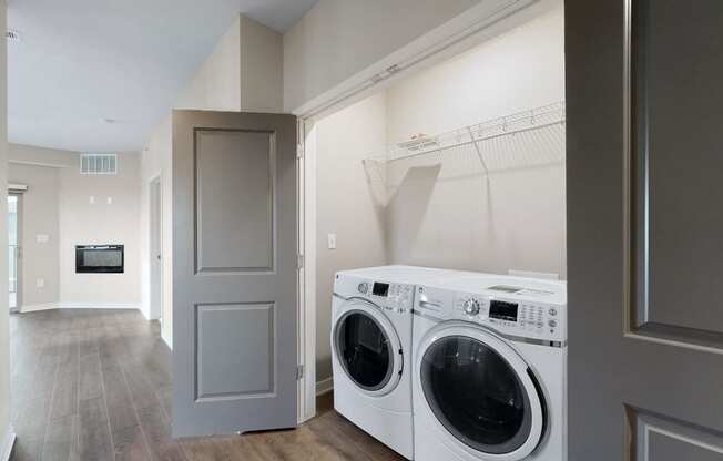 A washer and dryer are included in the 2 bedroom Marigold with den floor plan at WH Flats