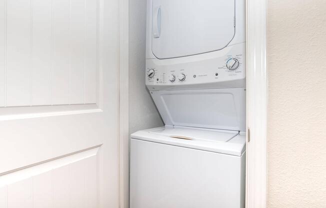 a microwave oven sitting on top of a refrigerator